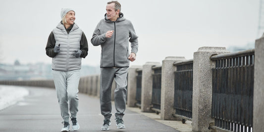 senior couple walk-running on cloudy day