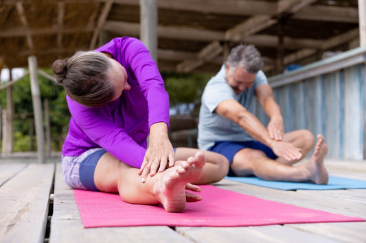 Senior couple participating in holistic stretching