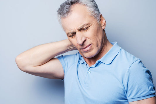 Senior man experiencing neck pain