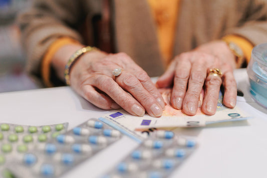 Senior woman paying for medication