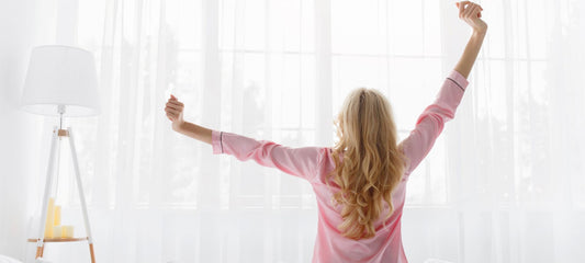 Woman stretching after waking up
