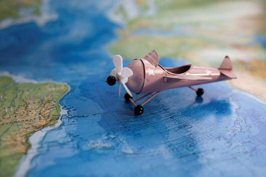 decorative airplane on world map for travel