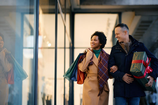 Happy mature couple shopping for the holiday season and avoiding stress