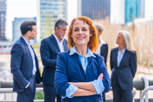 CBD women in business surrounded by colleagues