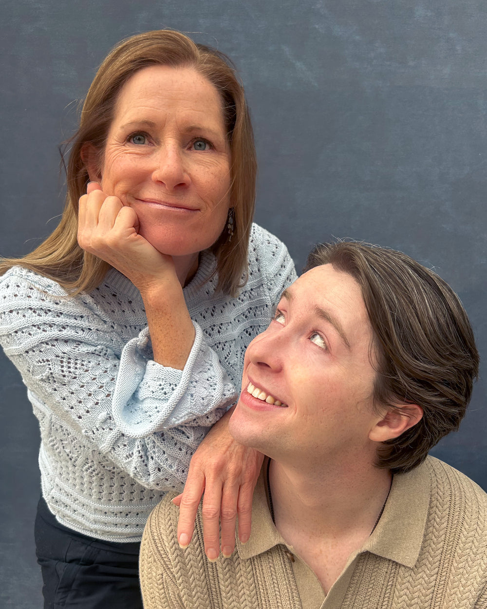 Debra Dullaghan Founder and owner of 55plus CBD and Collin Dullaghan director of marketing for 55plus CBD posing together against a plain background